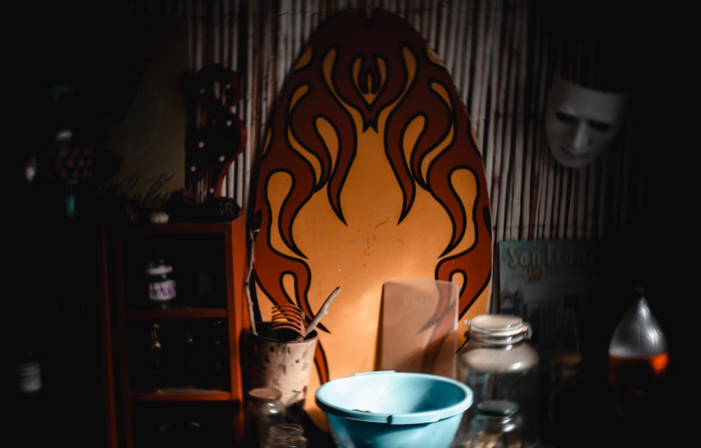 a blue bowl sitting on top of a wooden table