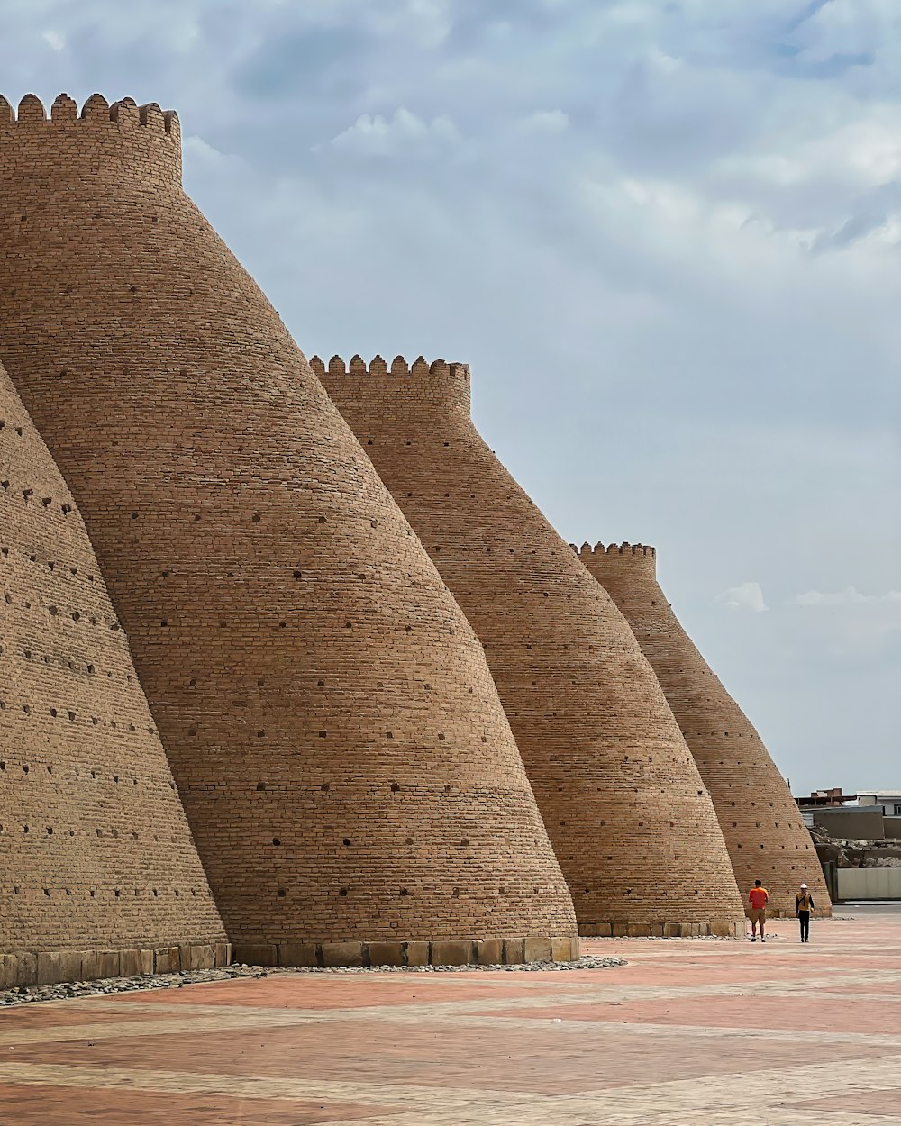 a group of tall brick buildings sitting next to each other