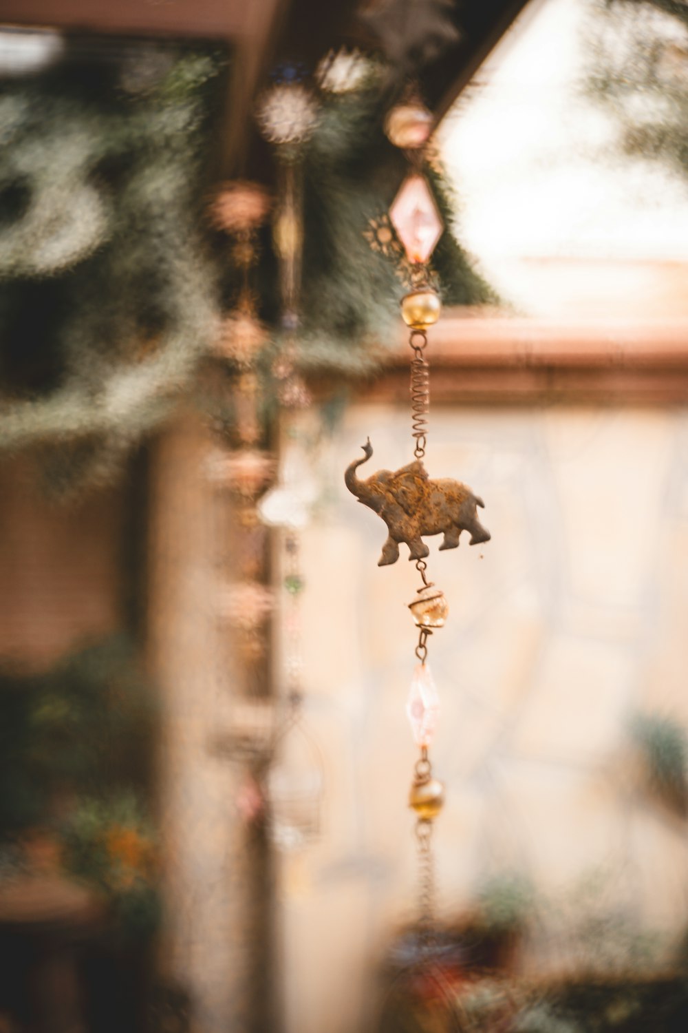 a wind chime with a bear on it