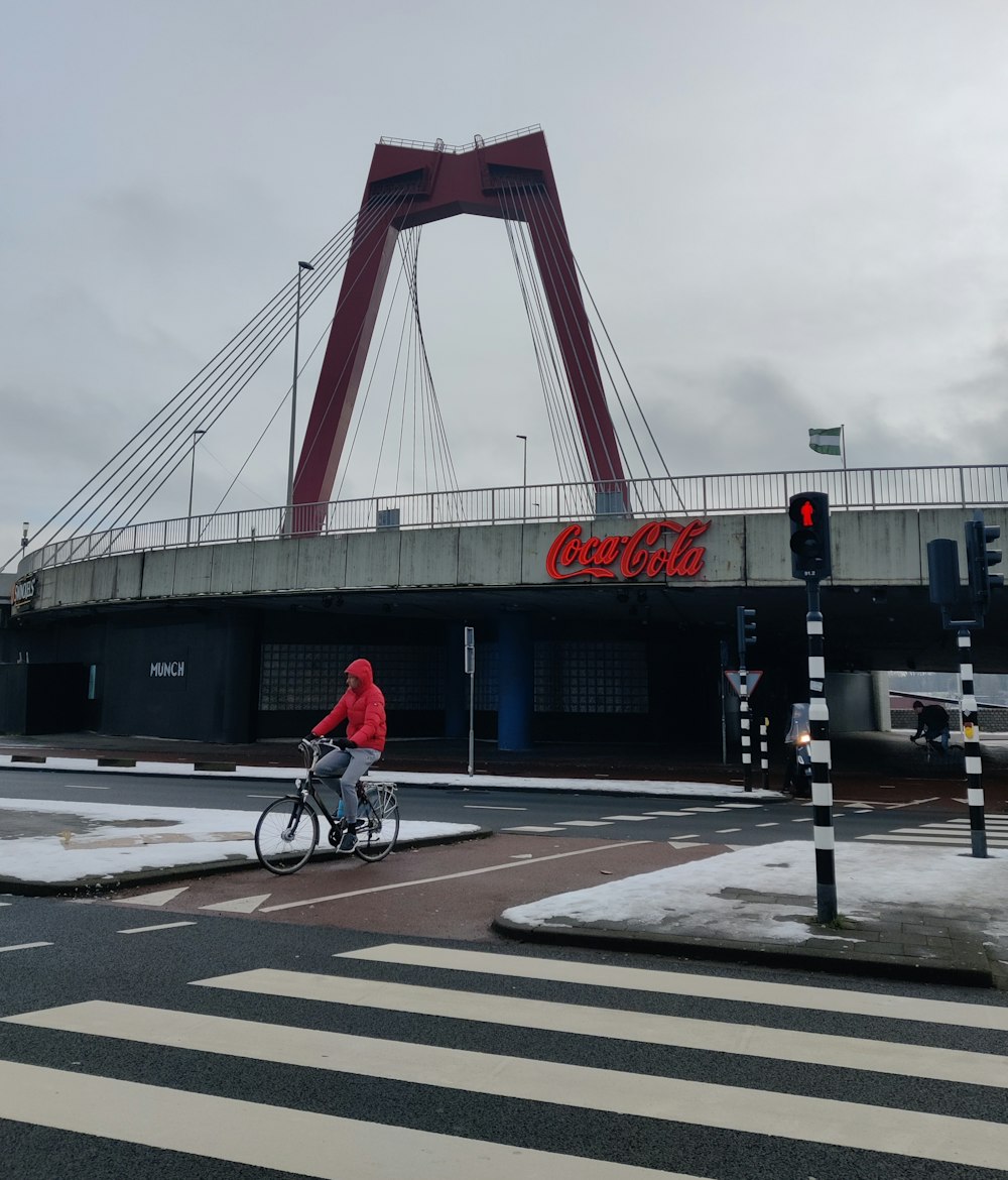 a person riding a bike across a street