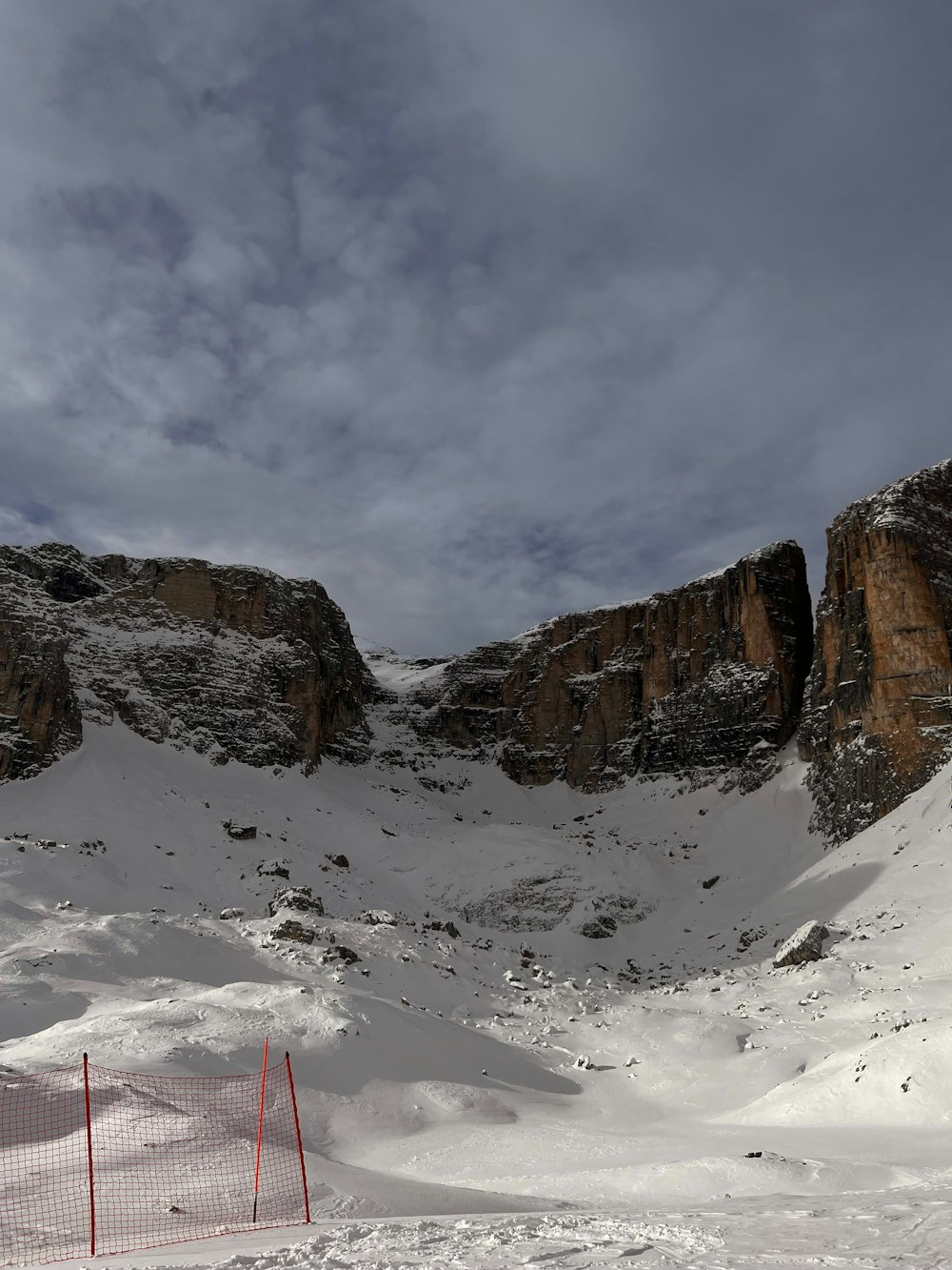 a man riding skis down a snow covered slope