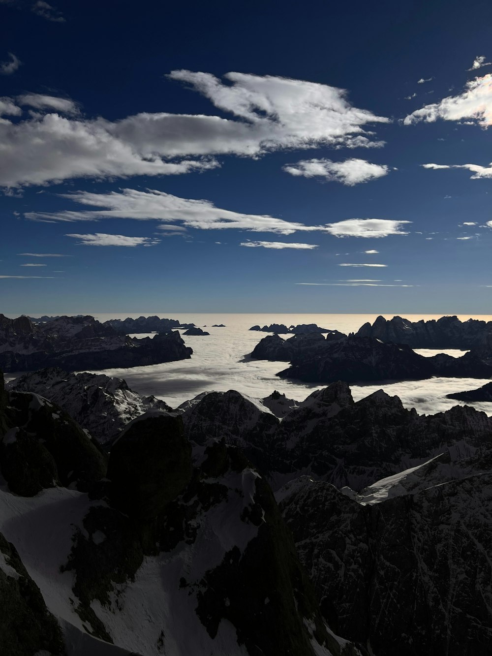 a view of some mountains and a body of water