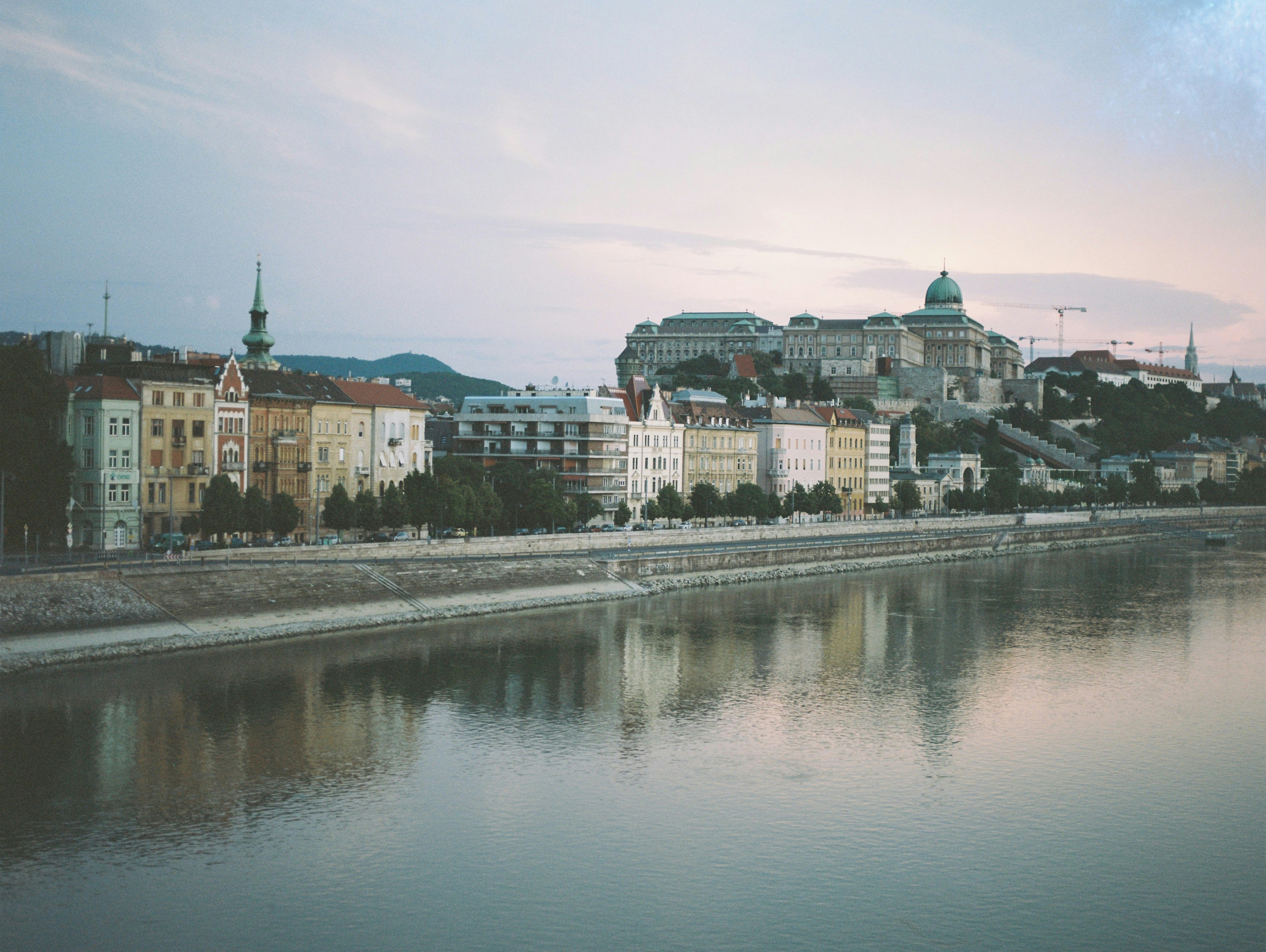 a body of water with a city in the background
