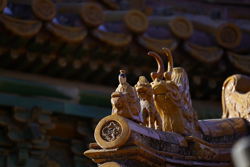 a close up of a statue with a bird on top of it