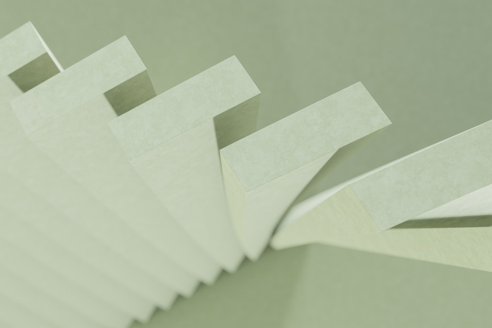 a stack of white papers sitting on top of a table