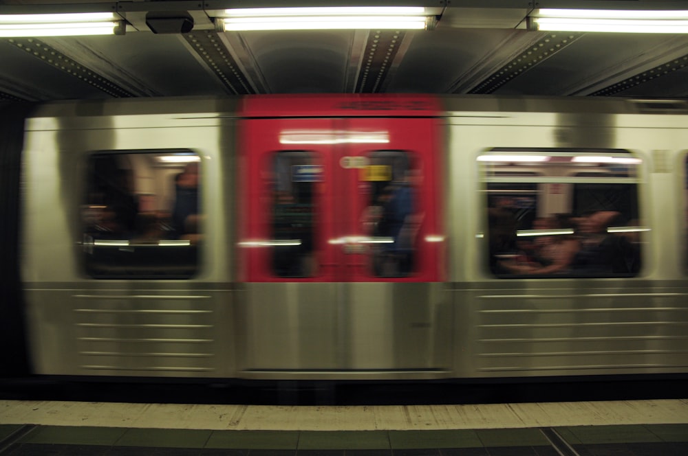 a subway train with people inside of it