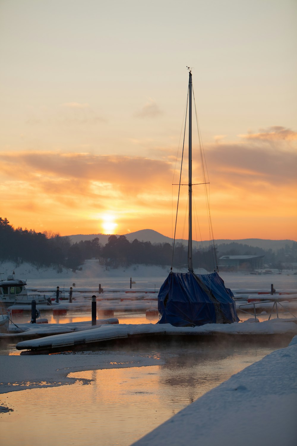 a sailboat sitting on top of a body of water