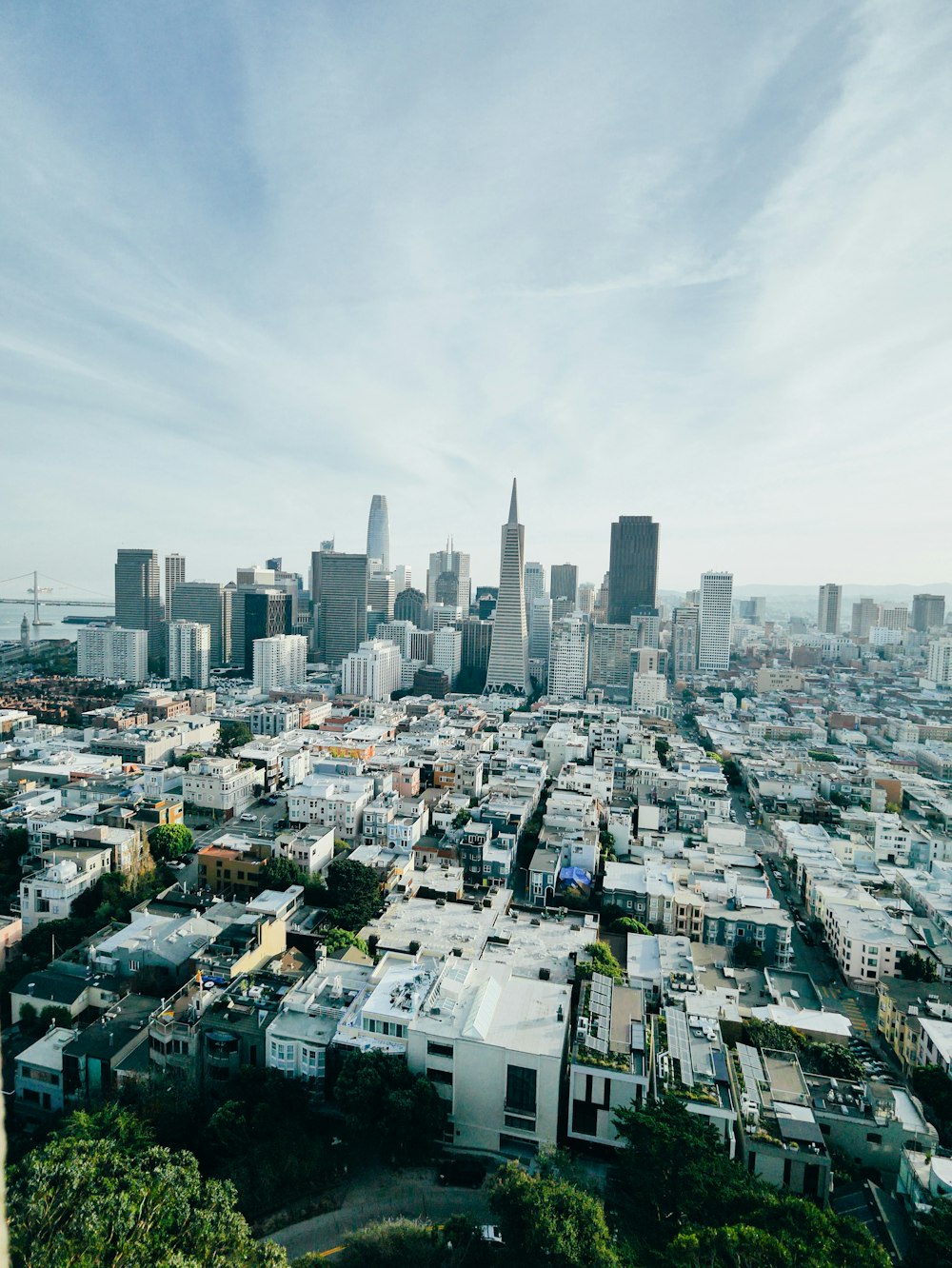 a view of a city from the top of a hill