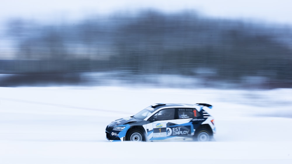 a rally car driving through the snow