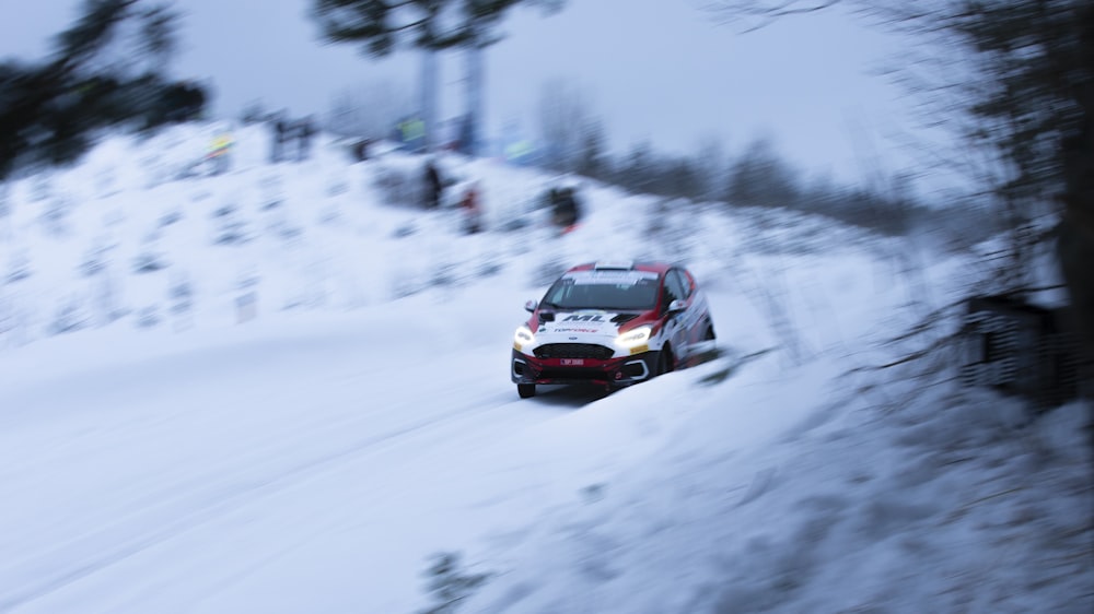 a car driving down a snow covered road