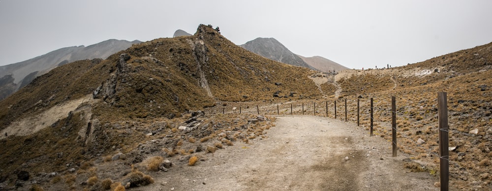 a dirt road in the middle of a mountain range