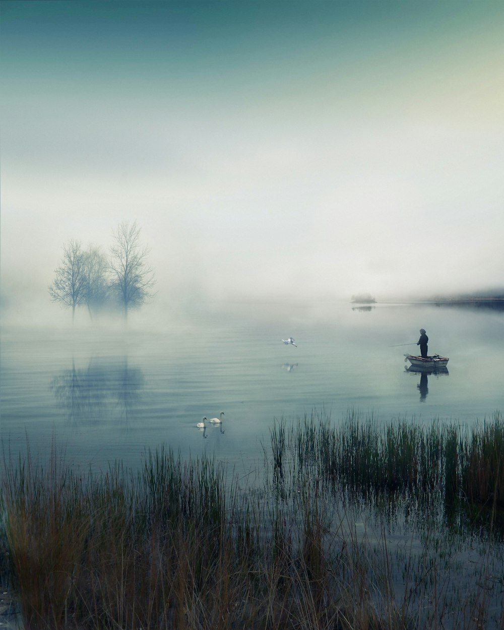 a person in a boat on a lake