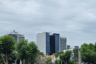 a group of people sitting on a bench in a park