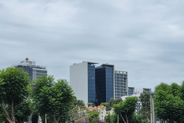 a group of people sitting on a bench in a park