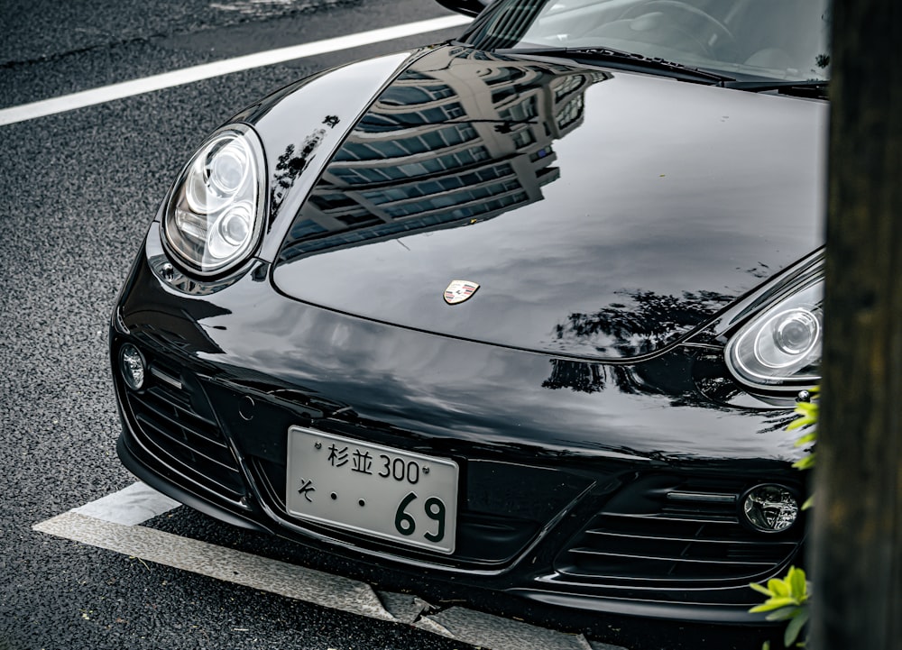 a black sports car parked on the side of the road