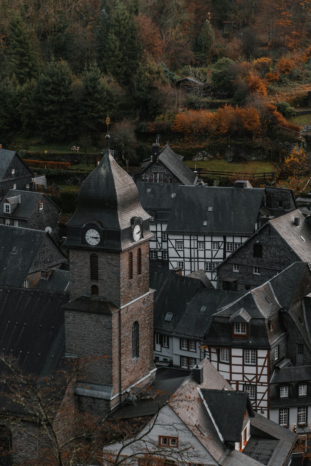 an aerial view of a town with a clock tower