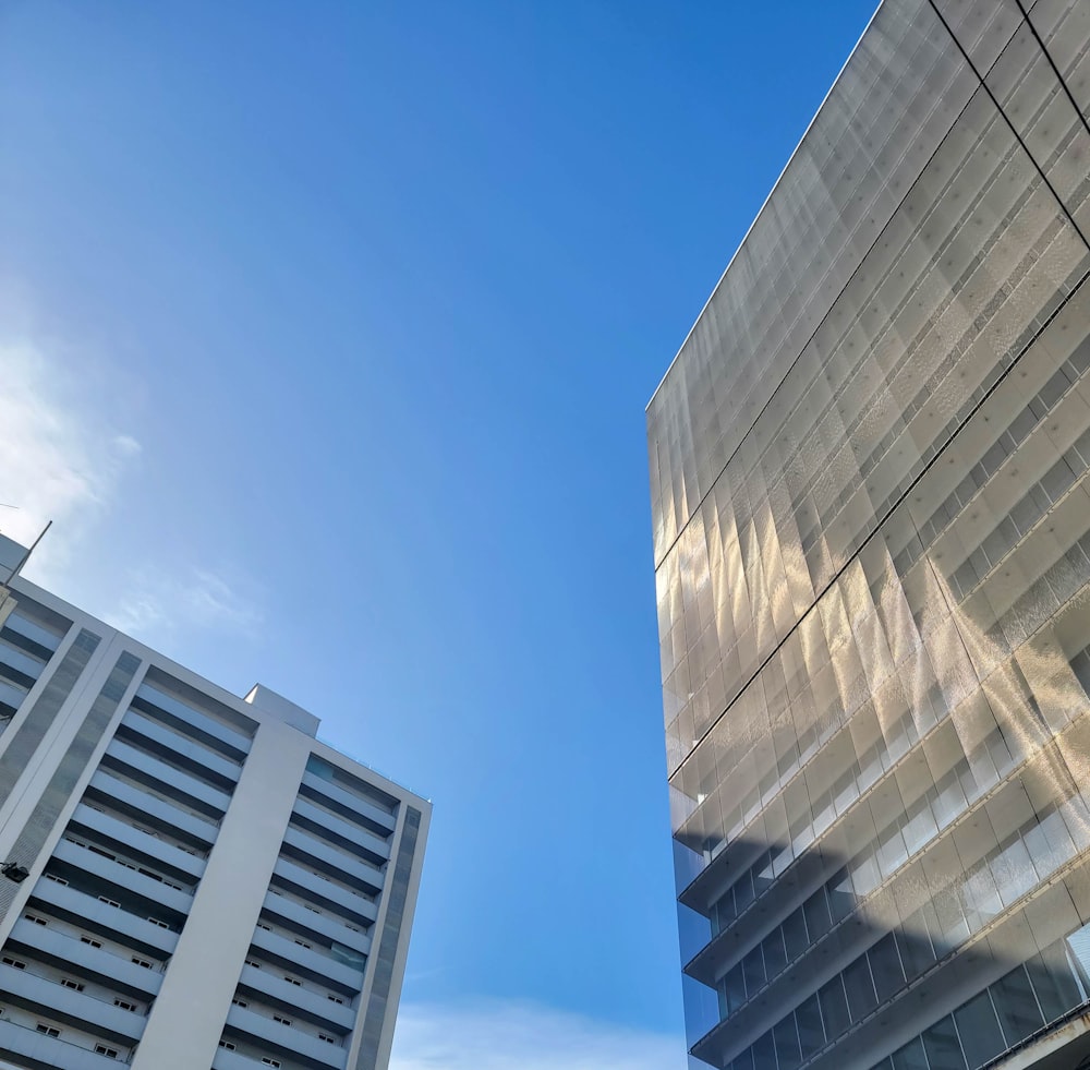 a tall building next to a very tall building