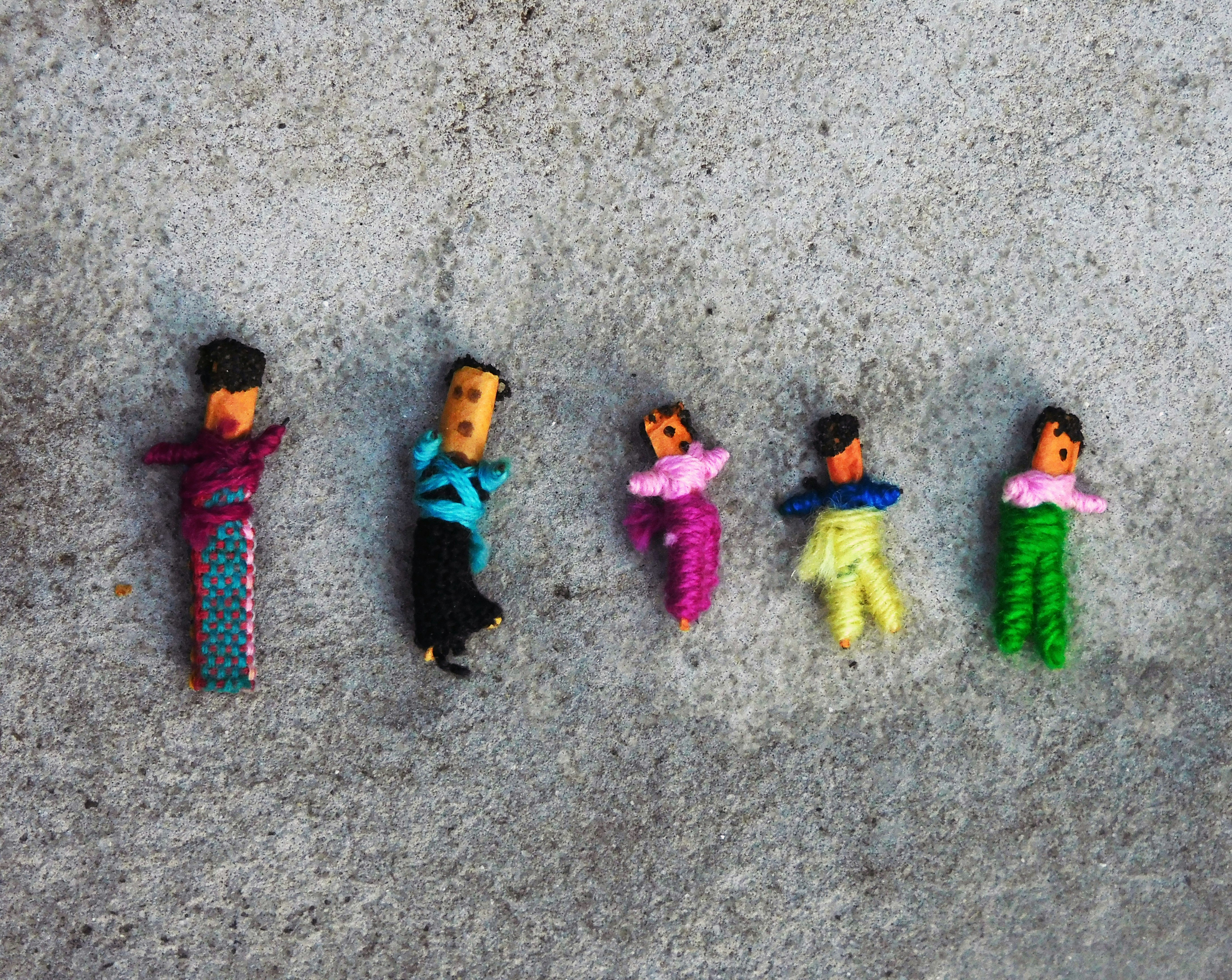 Tiny handmade Guatemalan worry dolls in colourful fabric