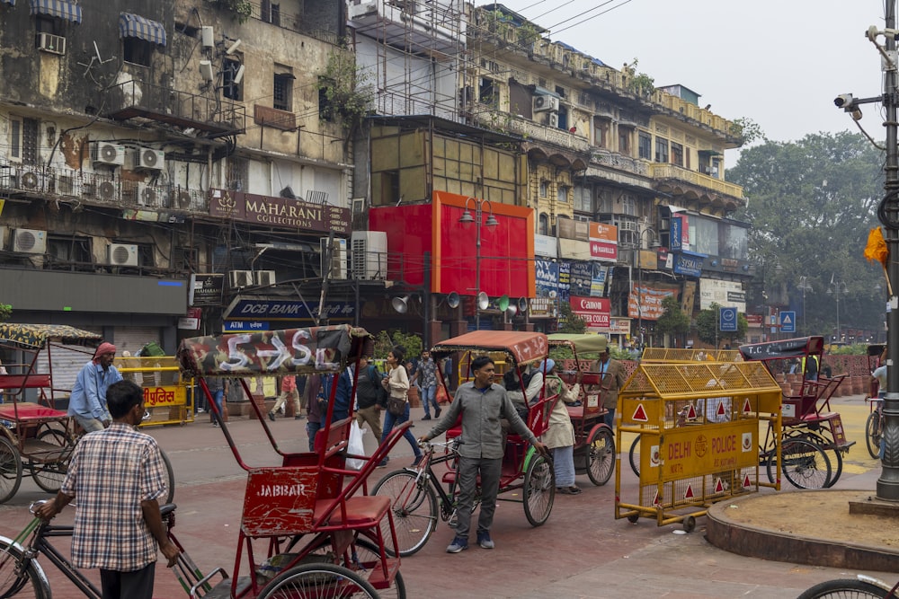 a group of people walking around a city street