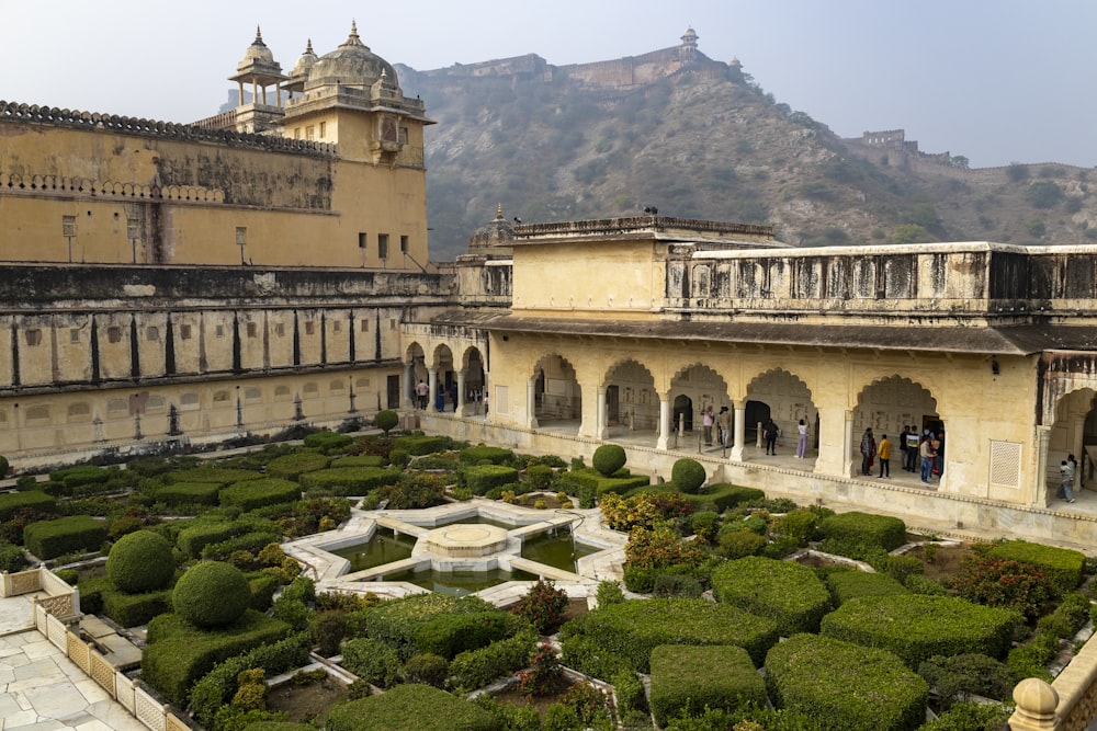 a view of a building with a garden in front of it