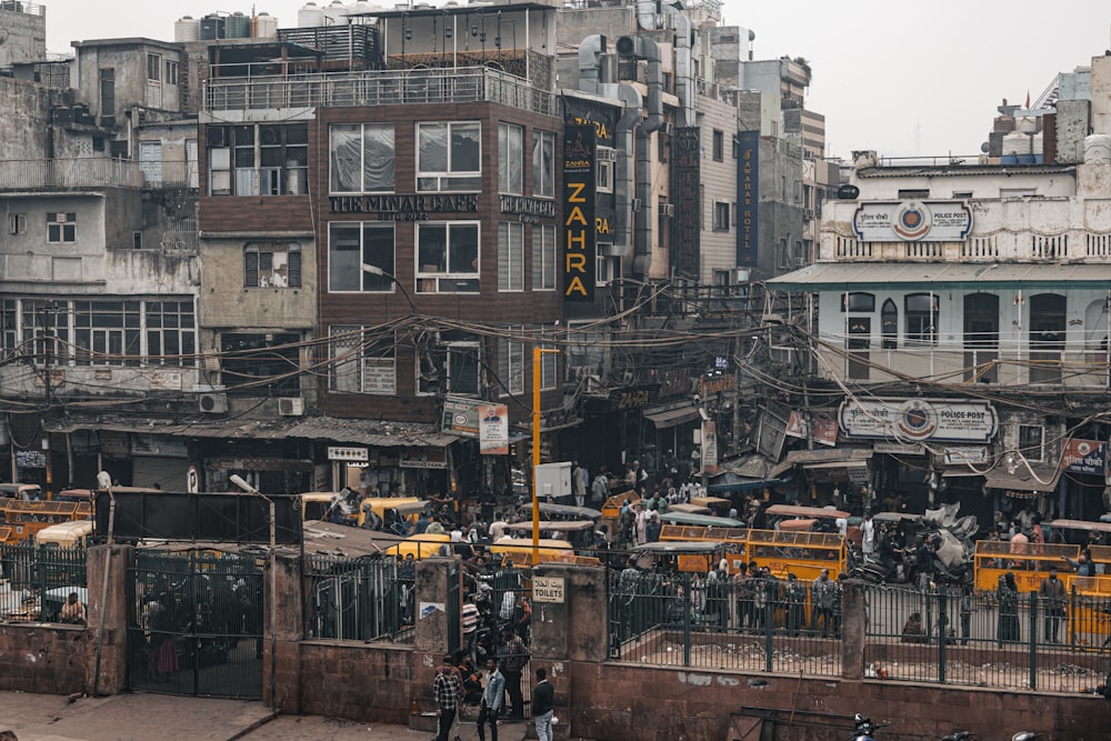 a group of people standing on top of a street