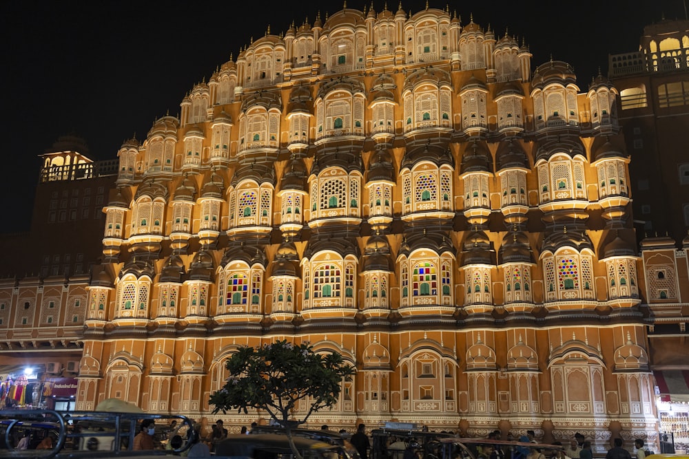 a large building with many windows lit up at night