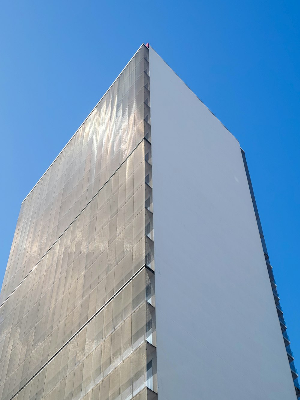 a tall building with a sky background