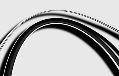 a black and white photo of a curved object