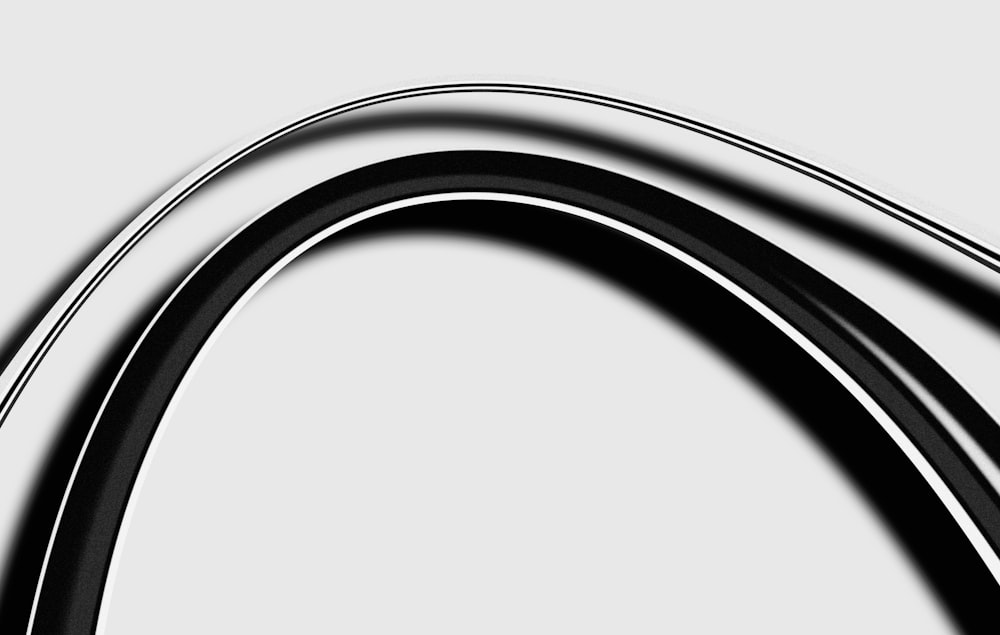 a black and white photo of a curved object