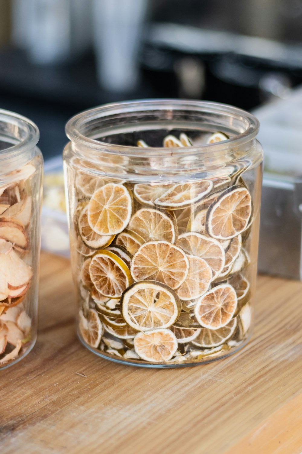 a couple of jars filled with sliced oranges