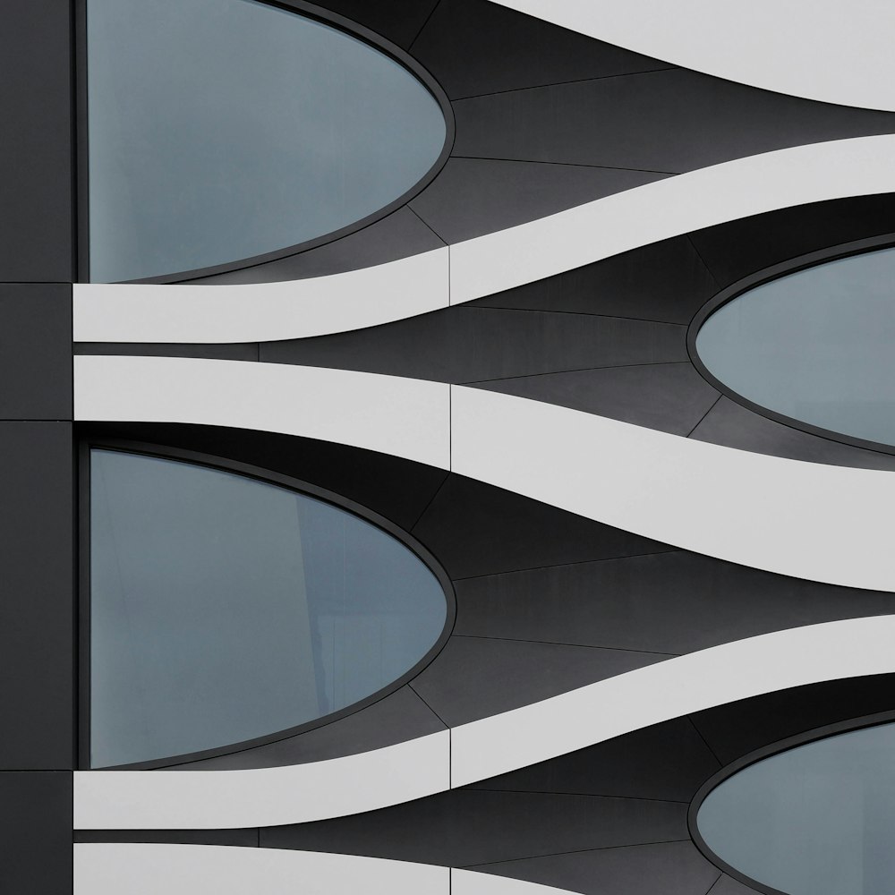 a black and white building with curved windows