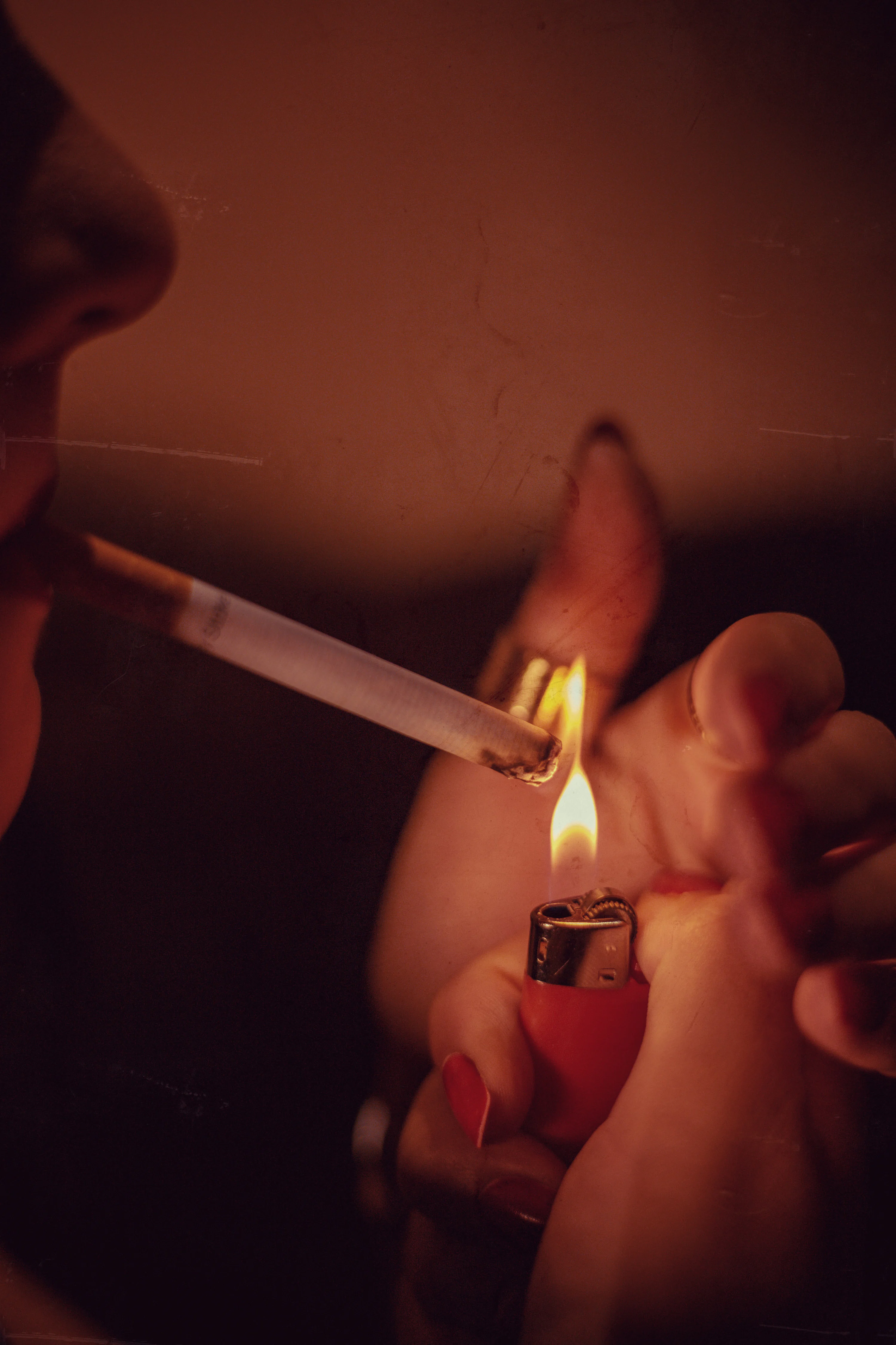 lighting cigarettes Man Cigarette Image & Photo (Free Trial) A woman lighting a cigarette