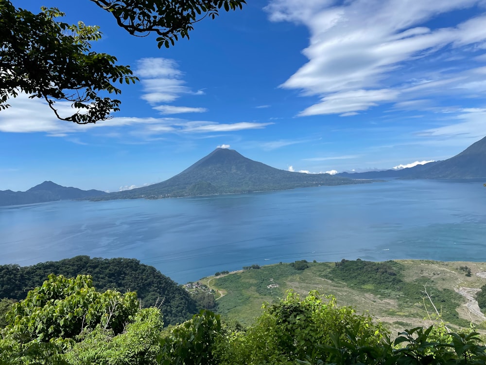 a view of a large body of water with mountains in the background