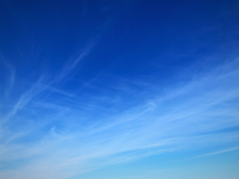 a blue sky with some clouds in it