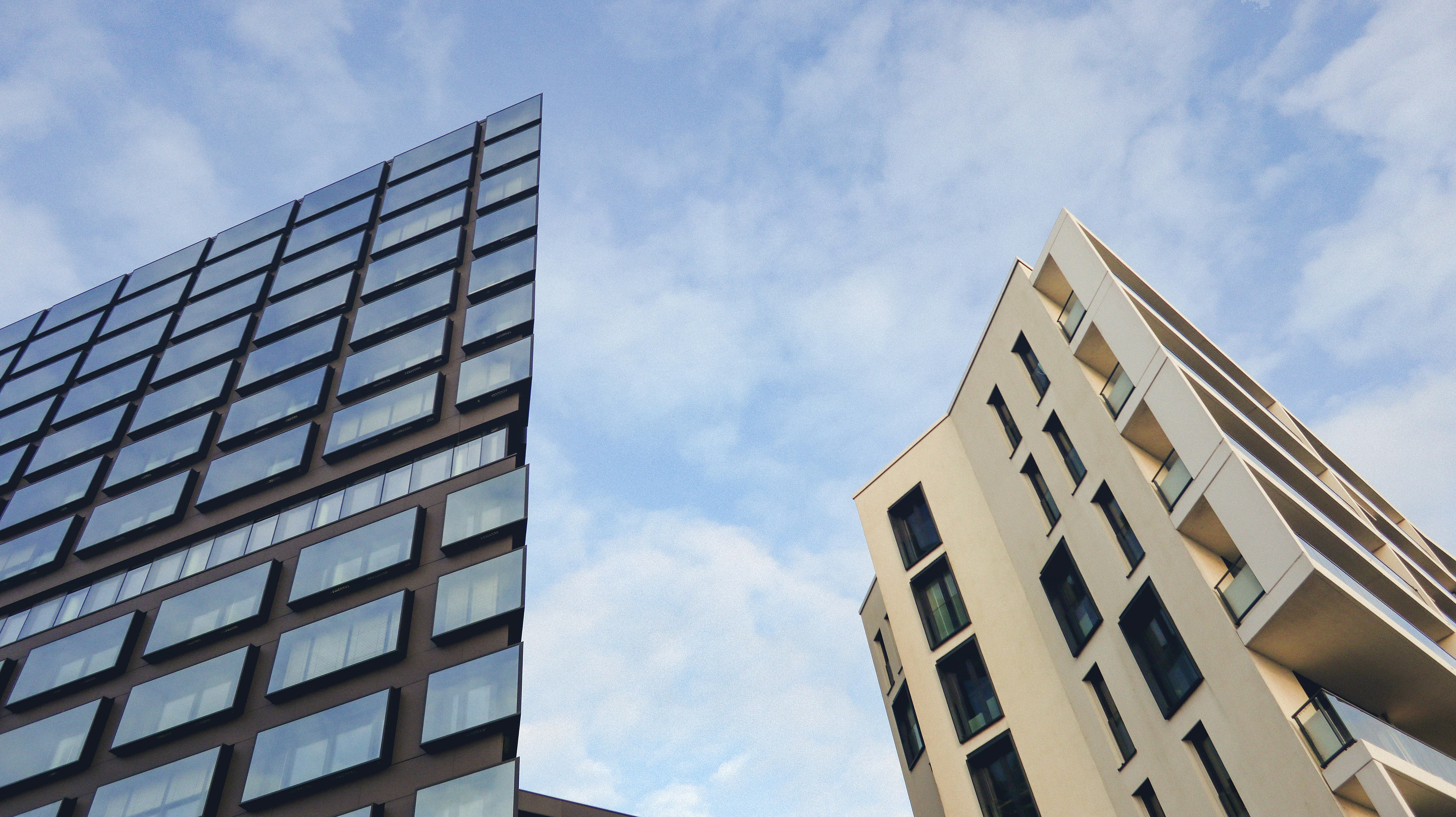 a couple of tall buildings next to each other