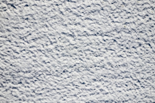 a textured background of white and blue paint