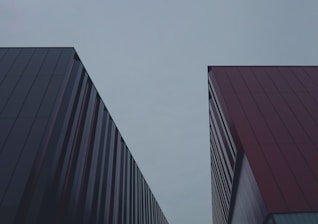 a couple of tall buildings sitting next to each other