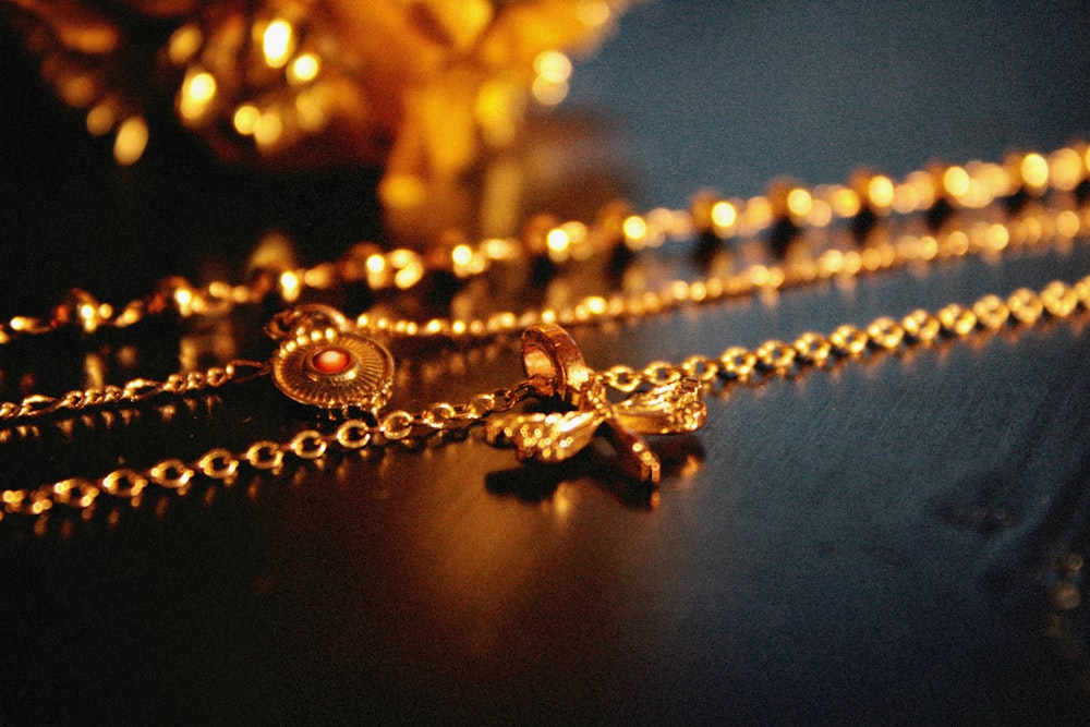 a close up of a necklace with a cross on it