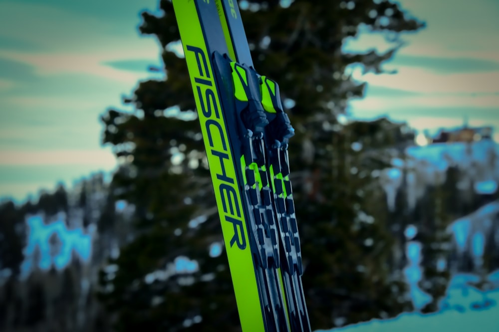 a pair of skis sitting on top of a snow covered slope