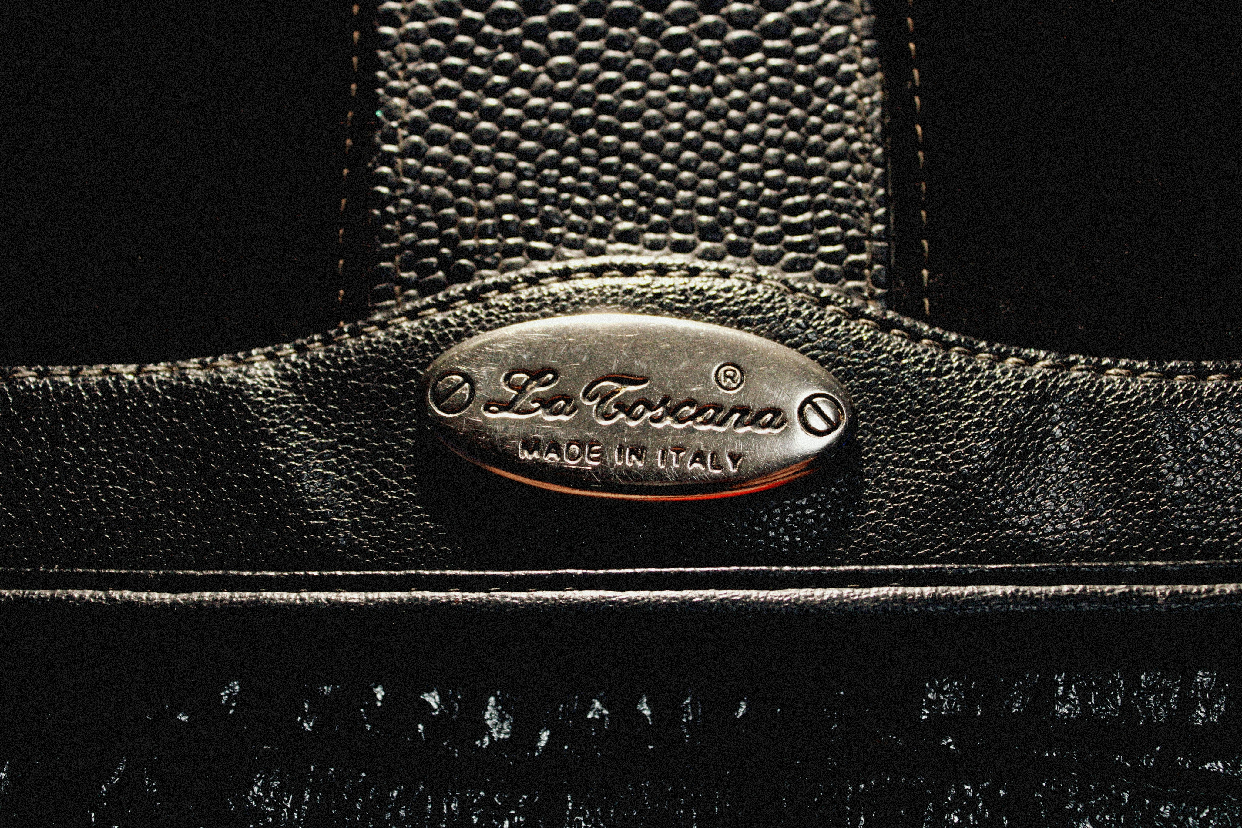 a close up of a black leather bag