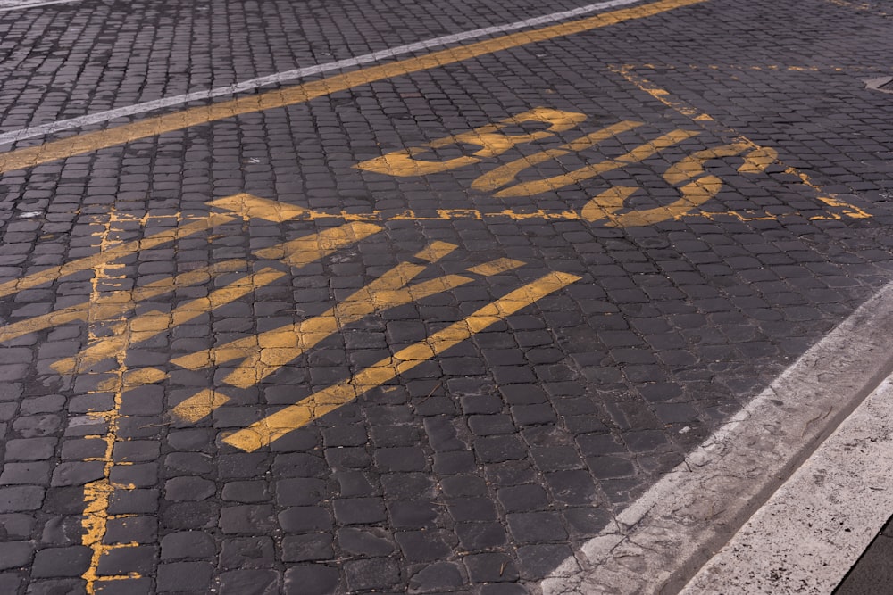 a stop sign painted on the side of a road