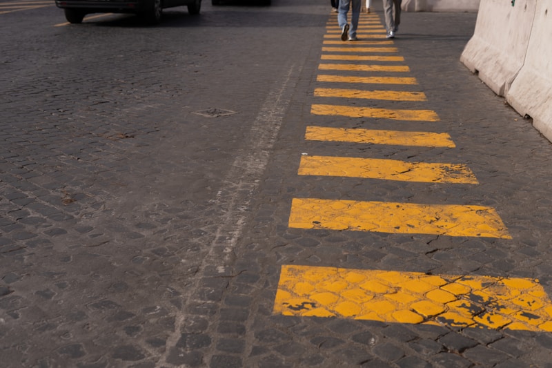 a couple of people walking down a street