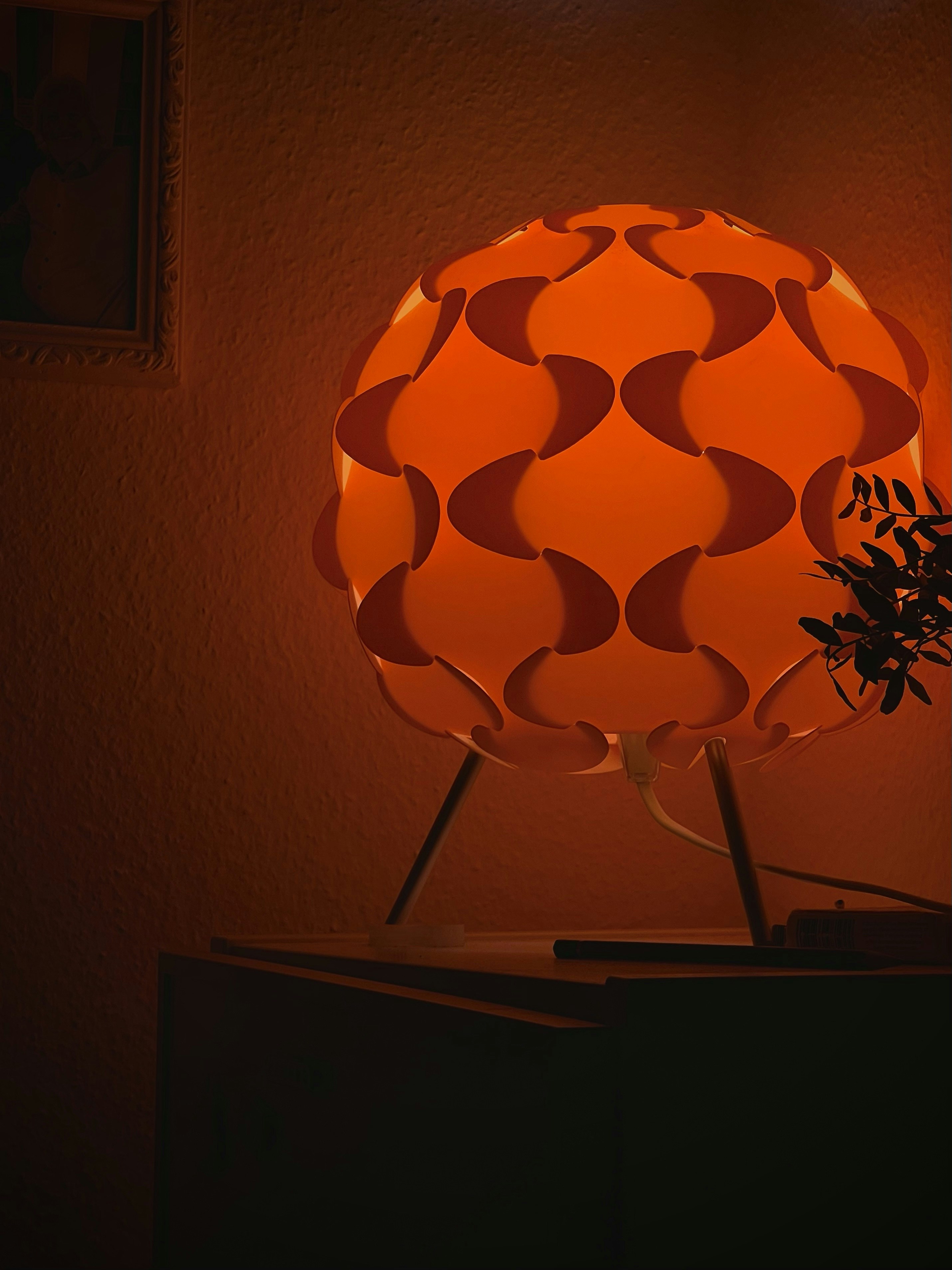 an orange light on a shelf