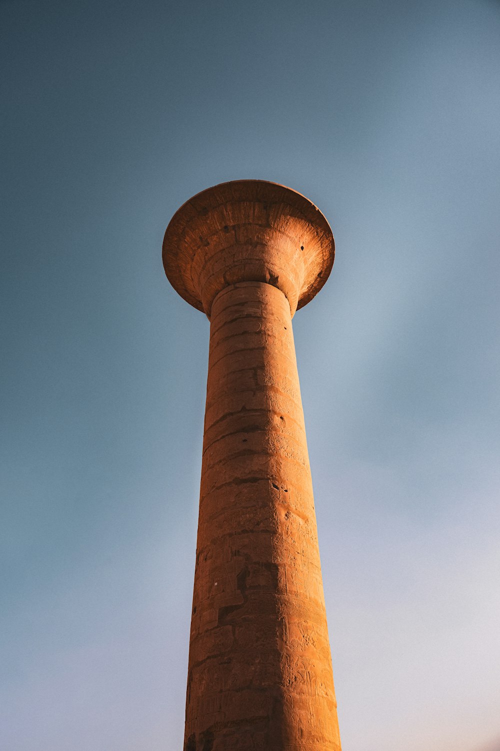 a tall brick tower with a sky background