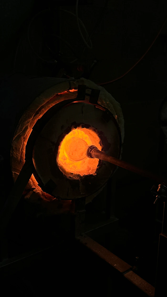 Close view of glass glowing orange in the furnace