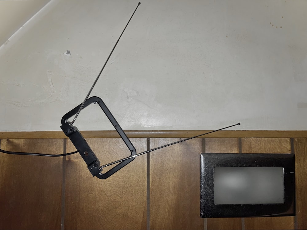 a broken television antenna hanging from the ceiling