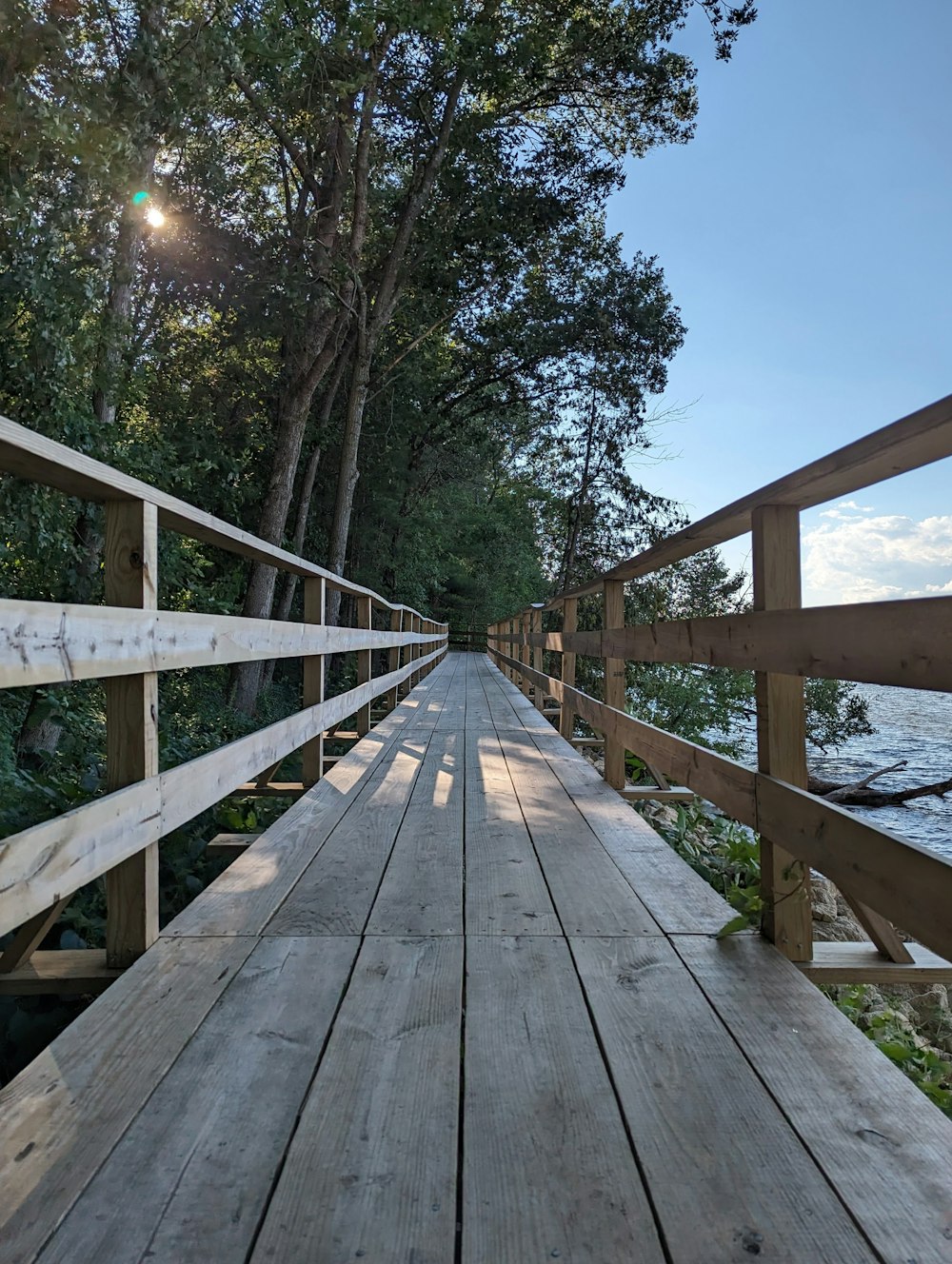 a long wooden bridge over a body of water