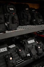 a shelf filled with backpacks in a store