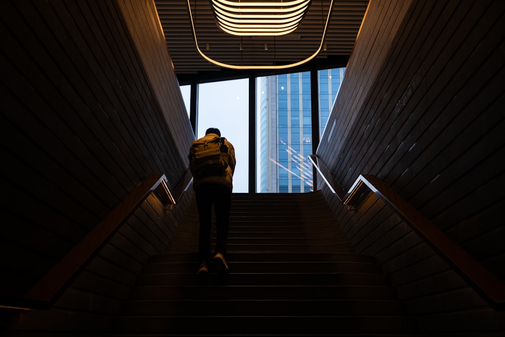 a man walking up a flight of stairs