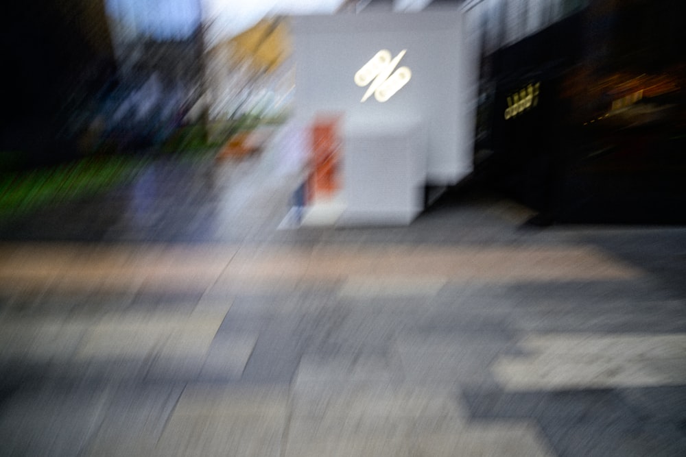 a blurry photo of a person walking down a street